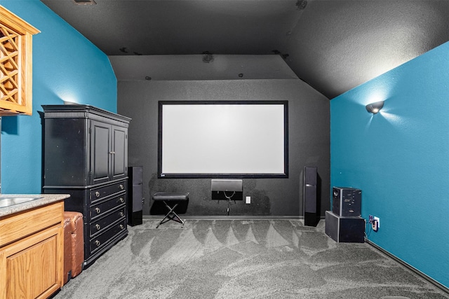 2505 Shoreline Dr, Keller, TX 76248 - carpeted home theater room featuring vaulted ceiling