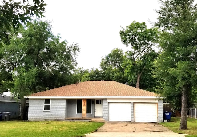 412 Ellis St, Allen, TX 75002 - view of front facade featuring an attached garage, driveway, brick siding, and covered porch
