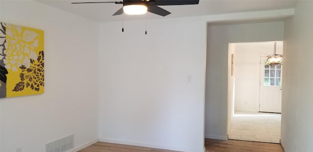 412 Ellis St, Allen, TX 75002 - empty room with ceiling fan, wood finished floors, and baseboards