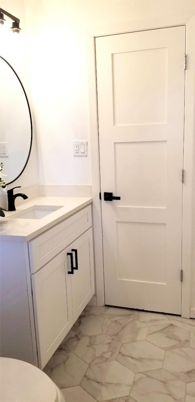 412 Ellis St, Allen, TX 75002 - bathroom featuring vanity and marble look tiles