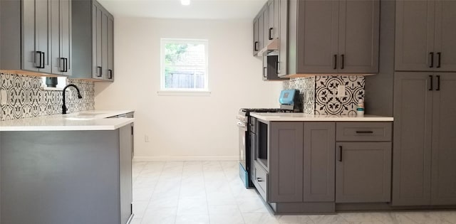 412 Ellis St, Allen, TX 75002 - kitchen with a sink, gas range, and gray cabinets