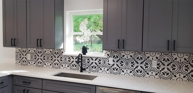 412 Ellis St, Allen, TX 75002 - kitchen with a sink, gray cabinets, light countertops, backsplash, and stainless steel dishwasher