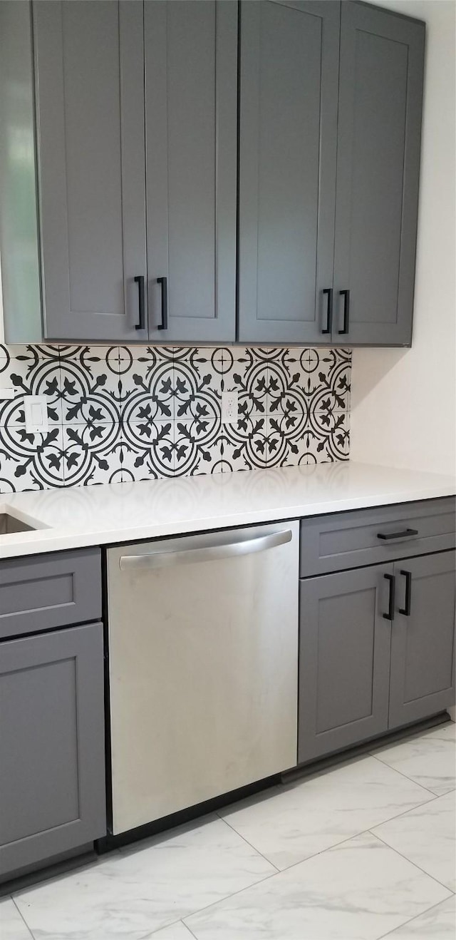 412 Ellis St, Allen, TX 75002 - kitchen featuring stainless steel dishwasher, gray cabinets, light countertops, and tasteful backsplash