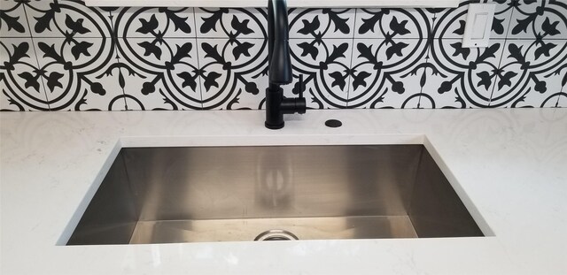 412 Ellis St, Allen, TX 75002 - kitchen view of pot filler, a sink, and light countertops