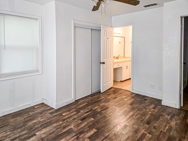 1155 Clay St, Canton, TX 75103 - unfurnished bedroom with a sink, wood finished floors, a closet, ensuite bathroom, and a ceiling fan