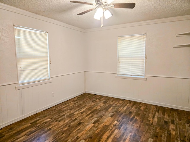 1155 Clay St, Canton, TX 75103 - empty room featuring dark wood-type flooring, a textured ceiling, a ceiling fan, and ornamental molding