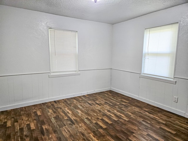 1155 Clay St, Canton, TX 75103 - empty room with dark wood-style flooring and a textured ceiling