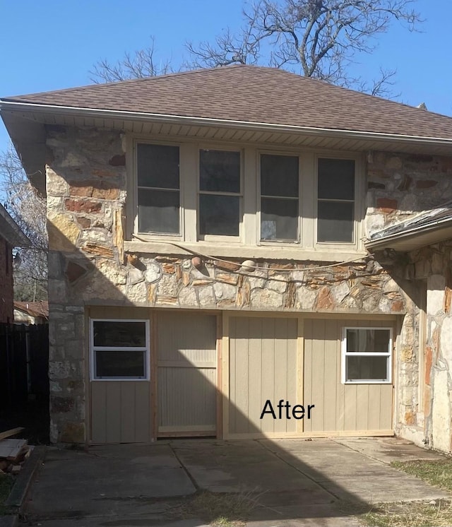 544 N Clinton St, Stephenville, TX 76401 - rear view of property with stone siding, a shingled roof, and a patio area