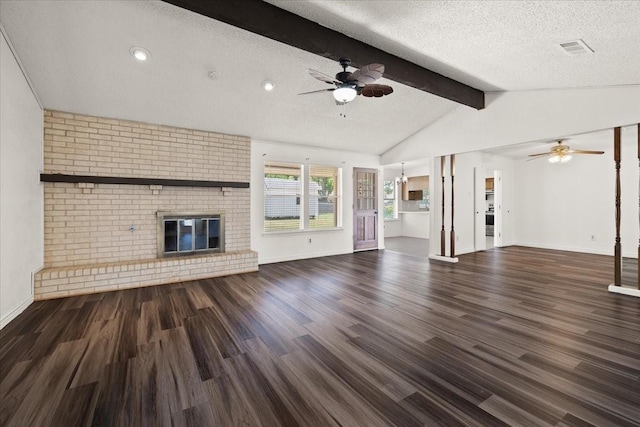 310 Naples Dr, Duncanville, TX 75116 - unfurnished living room with ceiling fan, wood finished floors, a fireplace, baseboards, and a textured ceiling