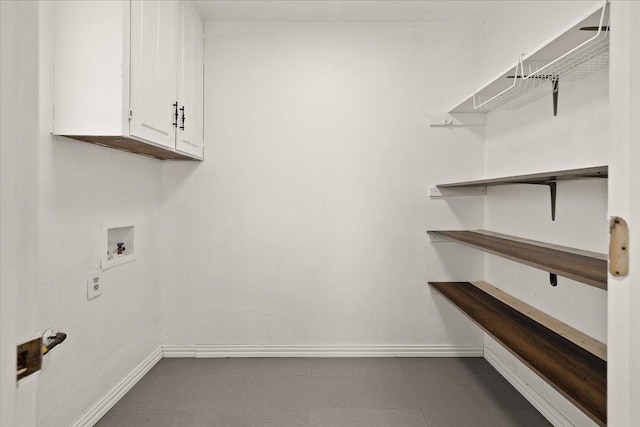 310 Naples Dr, Duncanville, TX 75116 - laundry room with baseboards, cabinet space, and washer hookup