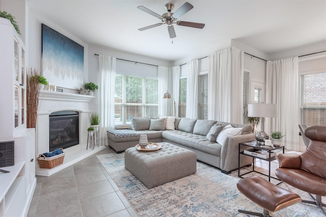 704 Granite Shoals Dr, Mckinney, TX 75071 - living room featuring plenty of natural light, ceiling fan, and a glass covered fireplace