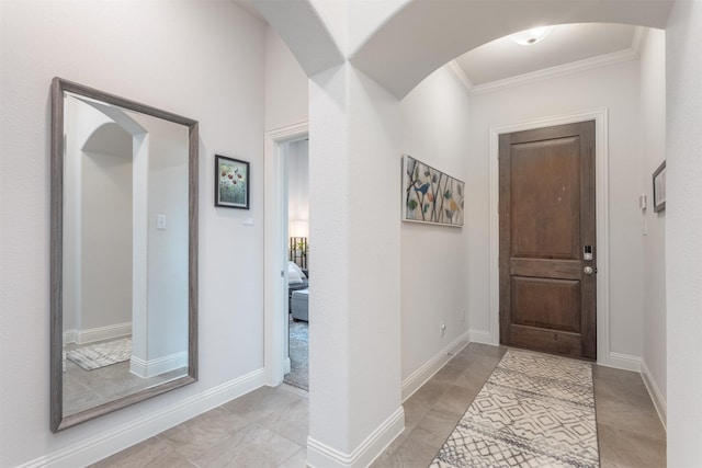 704 Granite Shoals Dr, Mckinney, TX 75071 - foyer featuring ornamental molding, arched walkways, and baseboards