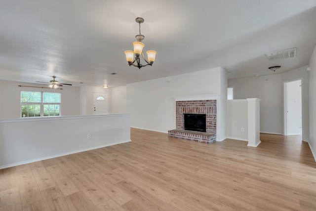 812 Piedmont Dr, Mckinney, TX 75071 - unfurnished living room with a chandelier, light wood-style flooring, a ceiling fan, and baseboards