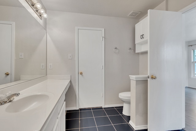 812 Piedmont Dr, Mckinney, TX 75071 - bathroom featuring vanity, toilet, and tile patterned flooring
