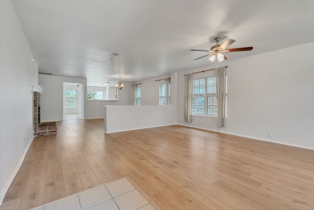 812 Piedmont Dr, Mckinney, TX 75071 - unfurnished living room featuring light wood finished floors, ceiling fan, and baseboards