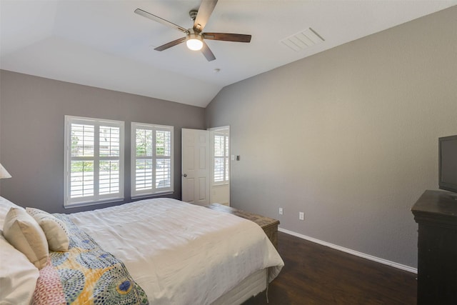 115 Roundup Rd, Waxahachie, TX 75165 - bedroom with dark wood finished floors, baseboards, vaulted ceiling, and a ceiling fan