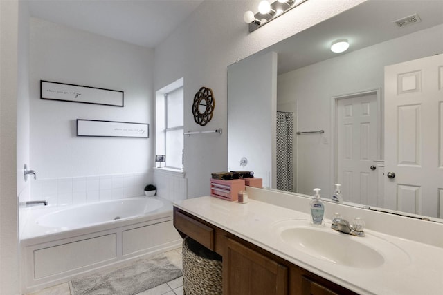 115 Roundup Rd, Waxahachie, TX 75165 - full bathroom featuring tile patterned floors, vanity, and a bath