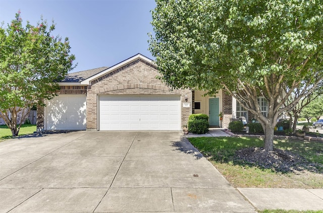 115 Roundup Rd, Waxahachie, TX 75165 - obstructed view of property with brick siding, concrete driveway, and a garage