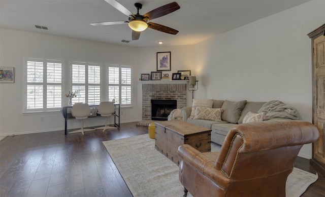 115 Roundup Rd, Waxahachie, TX 75165 - living area featuring a ceiling fan, plenty of natural light, a fireplace, and dark wood-style floors