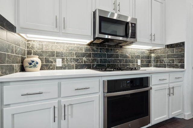 1809 13th St, Argyle, TX 76226 - kitchen with appliances with stainless steel finishes, white cabinetry, and tasteful backsplash