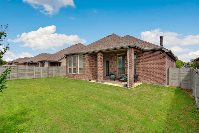 1809 13th St, Argyle, TX 76226 - back of property with brick siding, a patio area, and a shingled roof