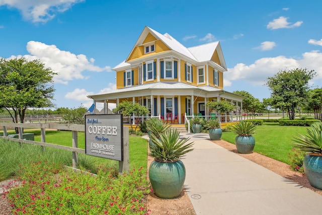 1809 13th St, Argyle, TX 76226 - view of front facade featuring covered porch and metal roof