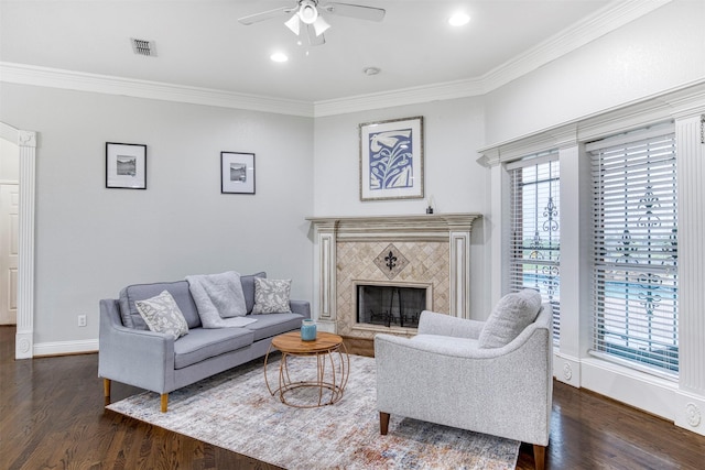 124 Lonesome Trl, Haslet, TX 76052 - living area with dark wood-type flooring, a ceiling fan, ornamental molding, a fireplace, and baseboards
