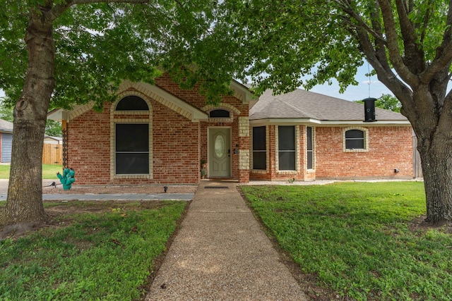 475 Maywood, Woodway, TX 76712 - view of front facade with brick siding, a front yard, and roof with shingles