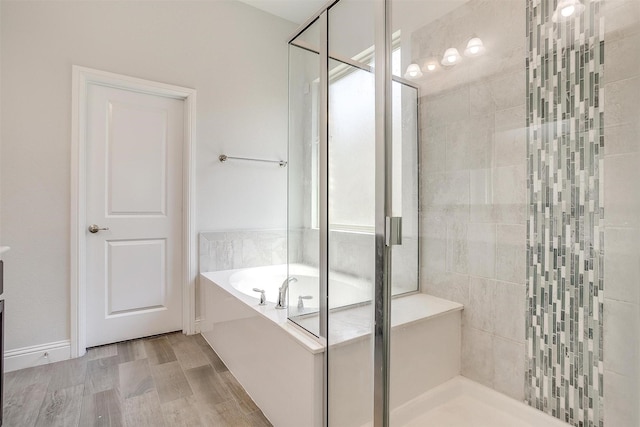 5825 Tuleys Creek Dr, Fort Worth, TX 76137 - bathroom featuring a shower stall, a garden tub, and wood finished floors