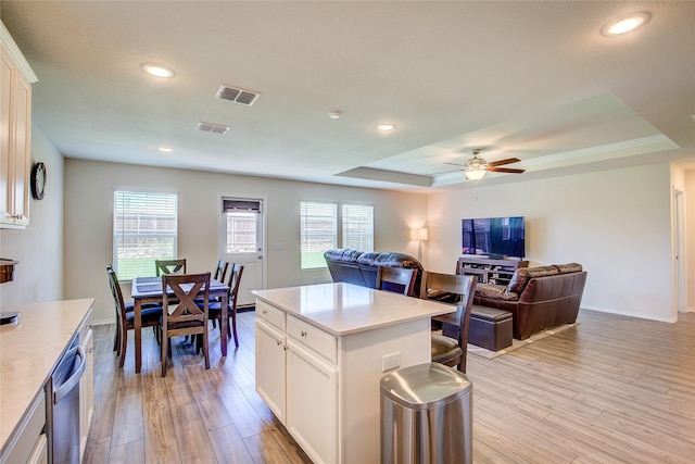 1805 Elderberry St, Royse City, TX 75189 - kitchen featuring a tray ceiling, light countertops, light wood-type flooring, ceiling fan, and recessed lighting