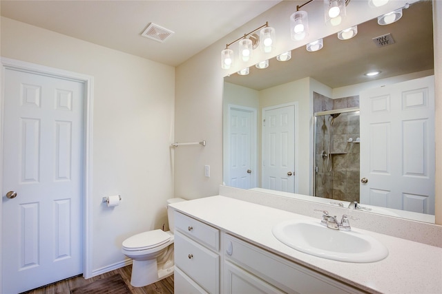 1805 Elderberry St, Royse City, TX 75189 - full bathroom with a stall shower, vanity, toilet, baseboards, and wood finished floors