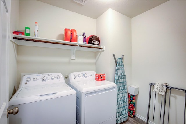 1805 Elderberry St, Royse City, TX 75189 - laundry area featuring washer and dryer, wood finished floors, and baseboards