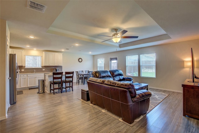 1805 Elderberry St, Royse City, TX 75189 - living area with a tray ceiling, ceiling fan, light wood-style flooring, recessed lighting, and baseboards