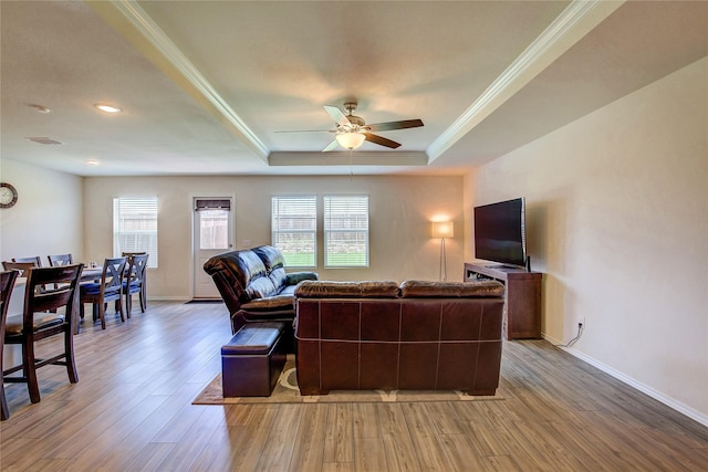 1805 Elderberry St, Royse City, TX 75189 - living area with a ceiling fan, healthy amount of natural light, light wood-type flooring, a tray ceiling, and crown molding