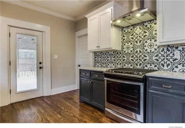 1951 College Ave, Fort Worth, TX 76110 - kitchen featuring stainless steel range oven, wall chimney range hood, ornamental molding, white cabinets, and backsplash