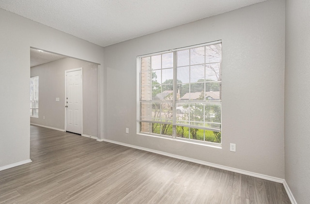 912 Brae Loch Dr, Dallas, TX 75217 - unfurnished room with wood finished floors and baseboards