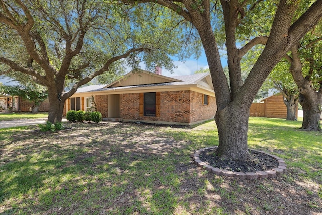 226 Hillcrest St, Sanger, TX 76266 - ranch-style home with brick siding and a chimney