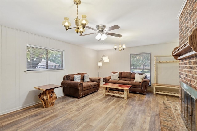 226 Hillcrest St, Sanger, TX 76266 - living area featuring a chandelier, wood finished floors, and ceiling fan