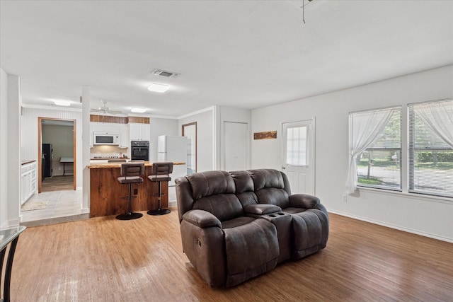 226 Hillcrest St, Sanger, TX 76266 - living area featuring light wood-style flooring, baseboards, and ceiling fan