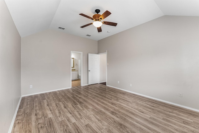 203 Mustang Trl, Celina, TX 75009 - unfurnished bedroom with vaulted ceiling, light wood finished floors, ensuite bath, and baseboards