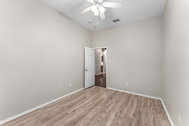 203 Mustang Trl, Celina, TX 75009 - spare room with a ceiling fan, light wood-style flooring, baseboards, and high vaulted ceiling