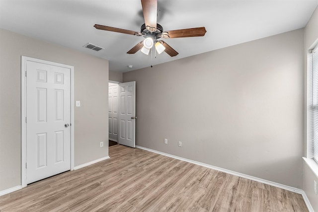 203 Mustang Trl, Celina, TX 75009 - unfurnished bedroom with light wood-style flooring, baseboards, and ceiling fan