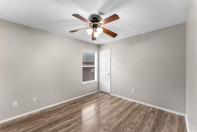 203 Mustang Trl, Celina, TX 75009 - spare room featuring wood finished floors, a ceiling fan, and baseboards