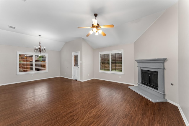 203 Mustang Trl, Celina, TX 75009 - unfurnished living room with lofted ceiling, a ceiling fan, a chandelier, dark wood-type flooring, and a fireplace with raised hearth