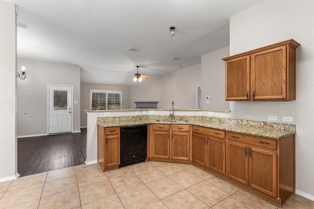 203 Mustang Trl, Celina, TX 75009 - kitchen featuring dishwasher, a sink, brown cabinetry, and ceiling fan