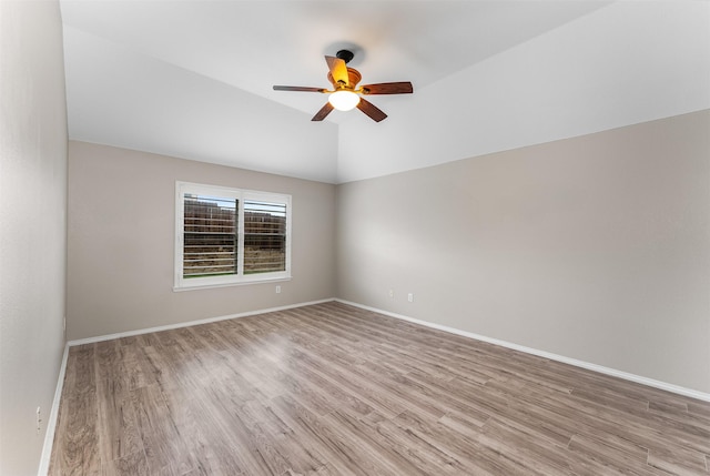 203 Mustang Trl, Celina, TX 75009 - empty room with light wood-style flooring, ceiling fan, baseboards, and vaulted ceiling