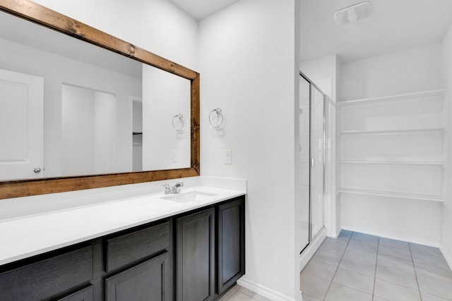 1408 Sebastian Dr, Forney, TX 75126 - bathroom featuring a shower stall, vanity, tile patterned flooring, and baseboards
