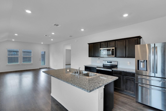 1408 Sebastian Dr, Forney, TX 75126 - kitchen featuring appliances with stainless steel finishes, a sink, dark wood-style flooring, recessed lighting, and light stone countertops