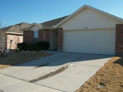 833 San Miguel Trl, Fort Worth, TX 76052 - ranch-style home featuring brick siding, an attached garage, and driveway