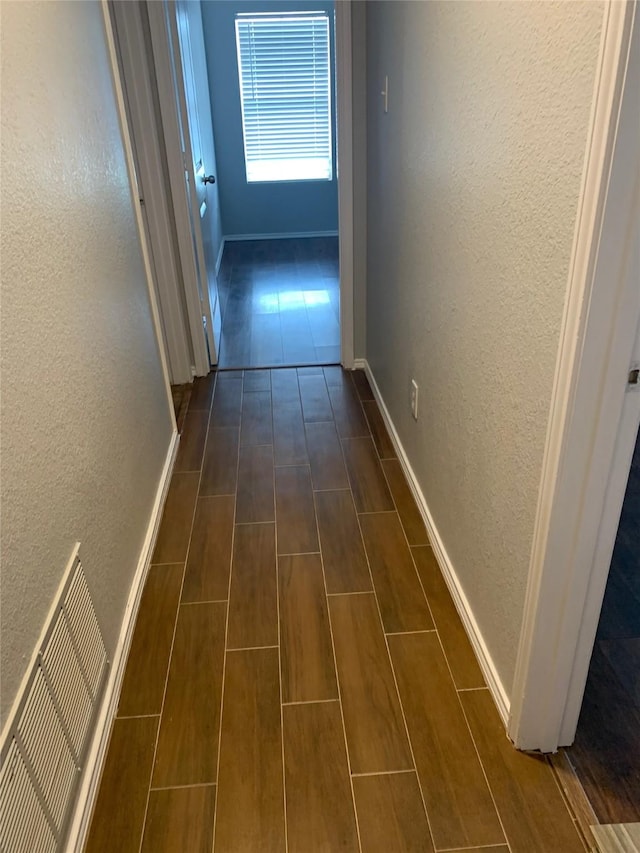 833 San Miguel Trl, Fort Worth, TX 76052 - hall featuring a textured wall, baseboards, and wood finish floors